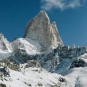 now-capped peaks of Mount Rwenzori surrounded by green valleys and dense forests in Uganda.