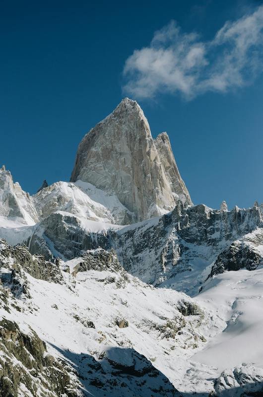 now-capped peaks of Mount Rwenzori surrounded by green valleys and dense forests in Uganda.