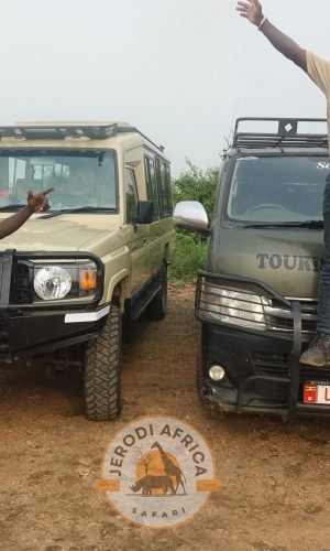 Jerodi Africa Safari professional field guides smiling while guiding tourists on a Uganda safari